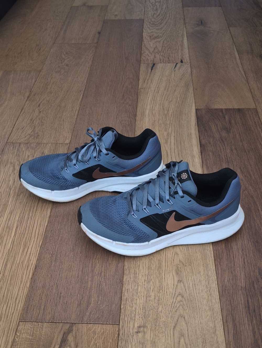 Nike Women's Blue Athletic Sneakers with Copper Swoosh